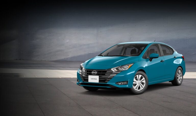 2025-nissan-versa-parked-in-front-of-house-v1-D
